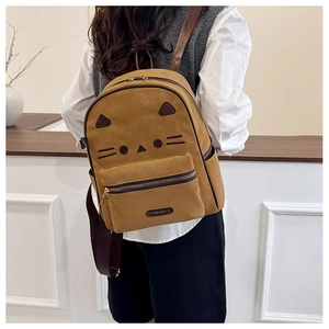 Detail of vintage caramel kitty cat backpack with cute 3D ears and front fashion pouch