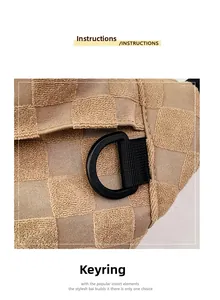 Close-up of khaki checkered textured fabric with a black D-ring buckle and durable strap