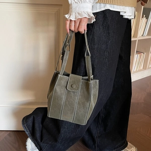 Olive green minimalist large capacity bucket bag with contrast stitching and top handle