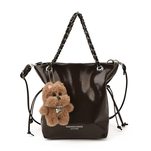 Deep brown patent leather tote bag with metal chain strap and cute bear charm