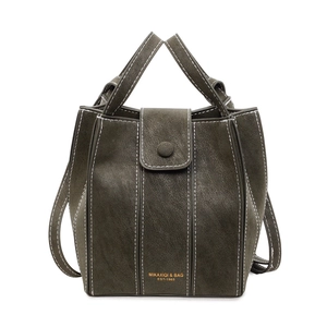 Minimalist dark green bucket bag with contrast stitching and adjustable shoulder strap