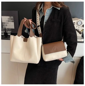 Detail of two-piece tote and crossbody bag set with patterned strap in cream and brown