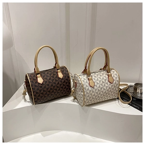 Detail of Boston bags featuring geometric triangle patterns and durable top handles