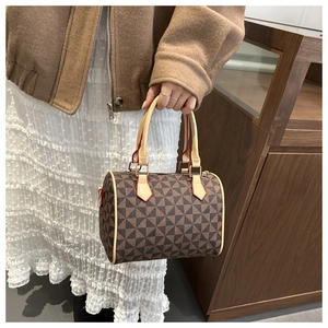 Detail of Boston handbag with geometric print and red edge cream leather handles