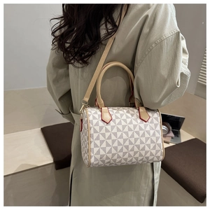Detail of Boston bag showing geometric triangle pattern and red edge finishing