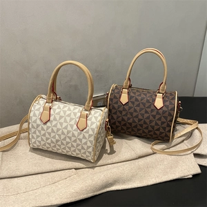 Retro Boston bag with geometric pattern in beige and brown with golden hardware