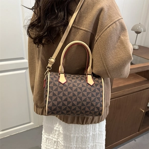 Retro Boston handbag with geometric windmill pattern and adjustable shoulder strap