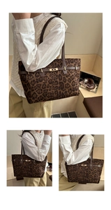 Detail of leopard print tote bag with brown leather strap and golden twist lock closure