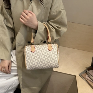 Vintage Boston bag with windmill pattern, cream leather handles and red edge accents
