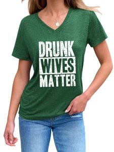 Detail of the white slogan print and V-neck on a heather dark green short sleeve T-shirt