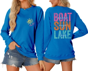 Detailed back view of blue sweatshirt featuring colorful boat waves sun rays typography