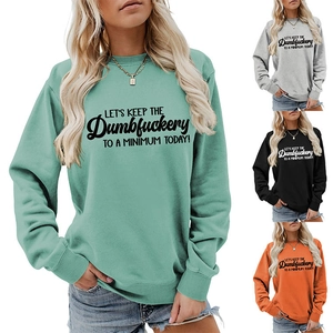 Detail of four colorful long sleeve sweatshirts featuring humorous slogan print