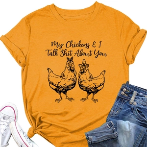 Detail of mustard yellow cotton T-shirt featuring funny chicken graphic and slogan print