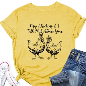Flat lay of yellow cotton t-shirt with funny chicken graphic and humorous slogan
