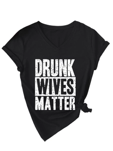 Detail of V-neck cotton T-shirt featuring distressed Drunk Wives Matter print and side knot