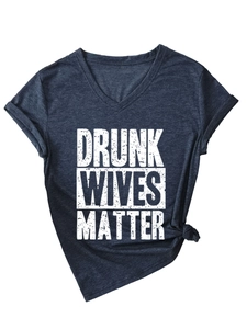 Detail of V-neck cotton T-shirt featuring rolled sleeves and side knot tie accent