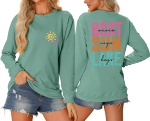 Detail showing back print of Boat Waves and Sun Rays on mint green sweatshirt