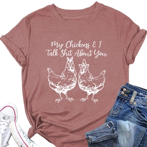 Detail of dusty rose T-shirt featuring funny chicken graphic and cursive lettering