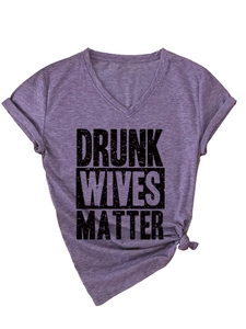Detail of purple V-neck tee with Drunk Wives Matter print and knotted hem detail