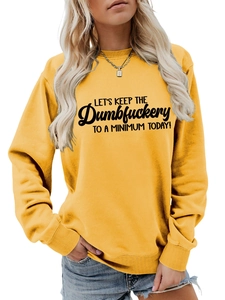 Detail of ribbed cuffs and collar on yellow cotton sweatshirt with black slogan text