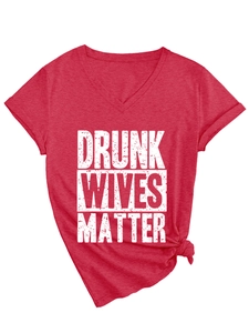 Detail of red V-neck T-shirt with white distressed graphic print and stylish side-tie knot