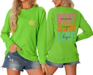 Detail view of neon green sweatshirt with 'LAKE DAYS' print and ribbed cuffs