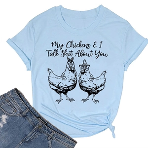 Detail of light blue cotton T-shirt featuring humorous chicken illustration and text print