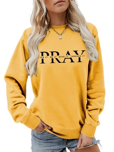 Detail of Pray For It slogan print on mustard yellow crewneck sweatshirt for women
