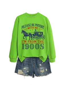 Detail of lime green sweatshirt with retro carriage graphic and vintage text design