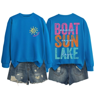Detail of blue Lake Days sweatshirt featuring colorful back print and sun icon
