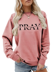 Close-up of PRAY FOR IT slogan print on dusty rose pink crewneck sweatshirt for women