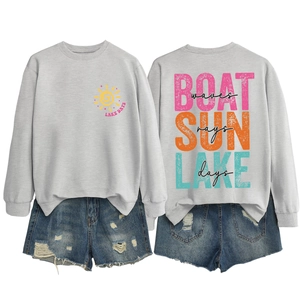 Detailed view of light grey Lake Days sweatshirt and distressed denim shorts set
