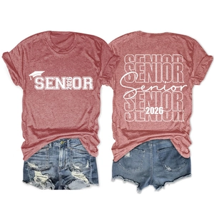 Detailed flat lay of Senior 2026 t-shirt with graduation cap print and denim shorts