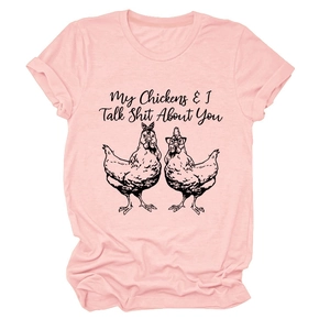 Close-up of pink cotton T-shirt featuring funny chicken graphic and humorous typography