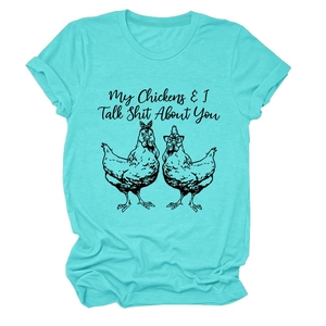 Detail of turquoise crew neck t-shirt with rolled sleeves and chicken graphic print