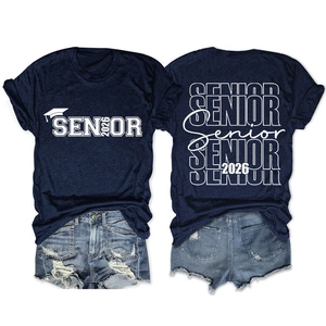 Flat lay of navy Senior 2026 t-shirt with graduation print and ripped denim shorts