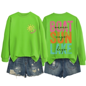 Flat lay of neon green Lake Days sweatshirt and distressed denim shorts set back view
