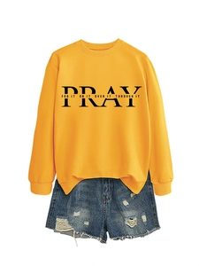 Detail of yellow round neck sweatshirt with Pray For It print and denim shorts set