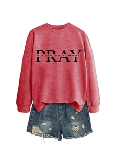 Detail of red crewneck sweatshirt with Pray print and ripped denim shorts for women