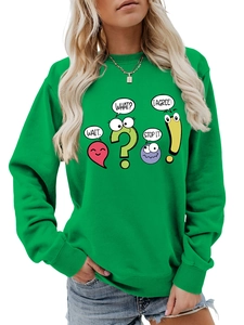 Close-up of funny cartoon speech bubbles and text graphics on green sweatshirt