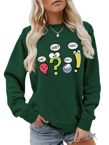 Close-up of dark green sweatshirt with colorful cartoon emoticons and funny text bubbles
