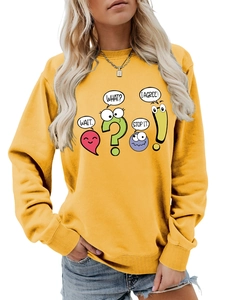 Detail of yellow sweatshirt featuring colorful cartoon punctuation characters and text