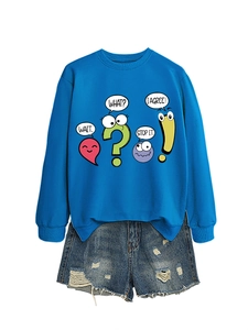 Flat lay of royal blue graphic sweatshirt with cartoon prints and distressed denim shorts