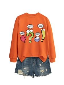 Detail of orange sweatshirt with cartoon prints and distressed light blue denim shorts