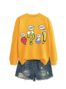 Detail of yellow sweatshirt with fun comic prints paired with distressed denim shorts