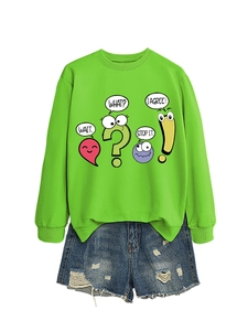 Detail of neon green sweatshirt with colorful emoji prints and frayed denim shorts set