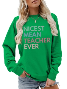 Detailed view of the bright green sweatshirt with Nicest Mean Teacher Ever print