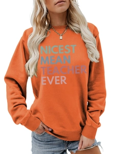 Detail of orange long-sleeve sweatshirt featuring Nicest Mean Teacher Ever print design