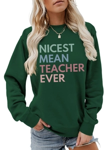 Close-up of dark green sweatshirt featuring colorful Nicest Mean Teacher Ever print