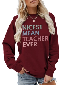Detail of the ribbed neckline and Nicest Mean Teacher Ever print on burgundy sweatshirt